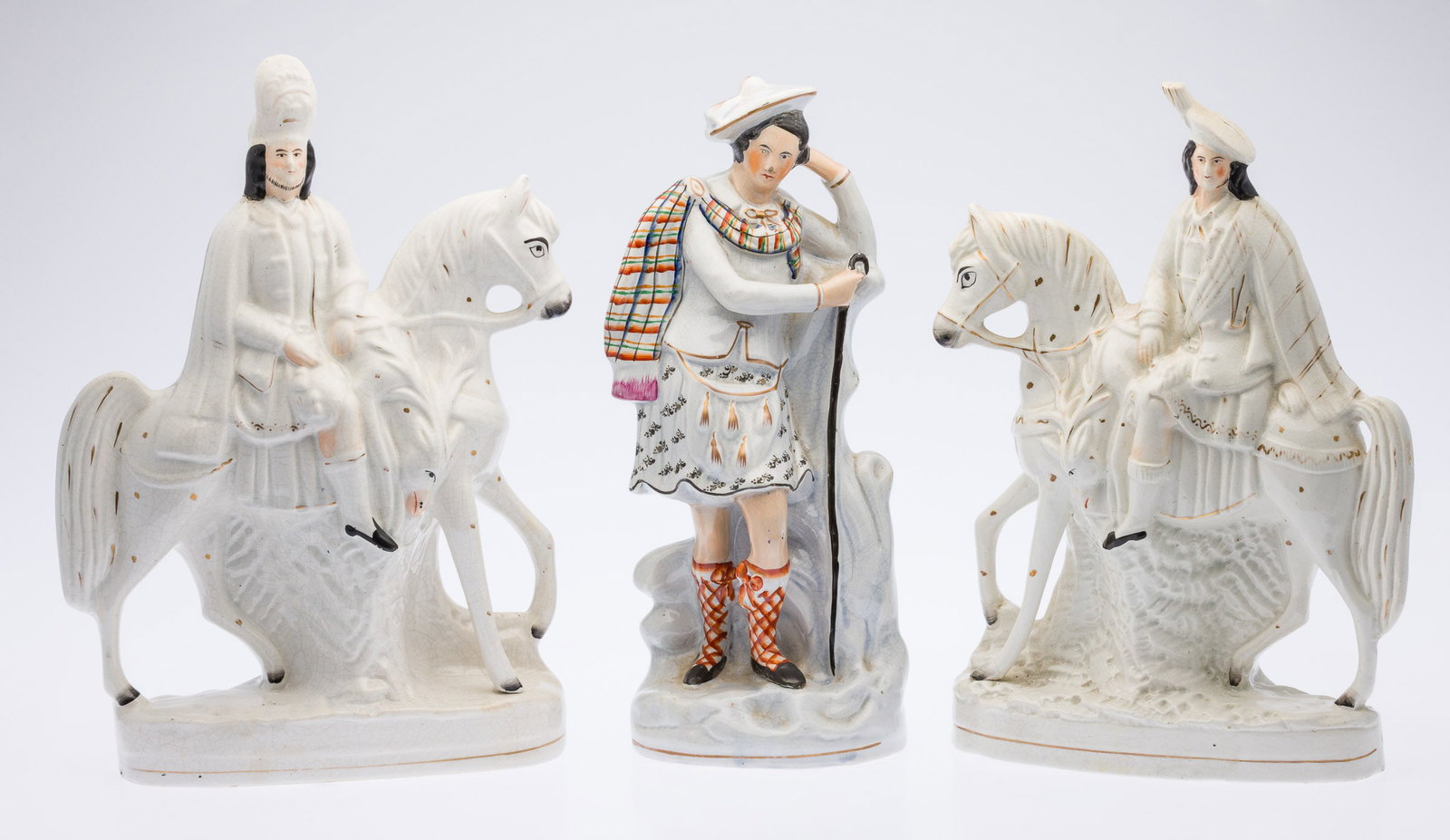 3 Staffordshire Figurines, 19th C: Property from a Savannah, GA Estate Description: 3 Staffordshire Figurines, 19th C, comprising a pair of men on horseback and a man in a kilt, all unmarked. Measurements: Height: of largest on