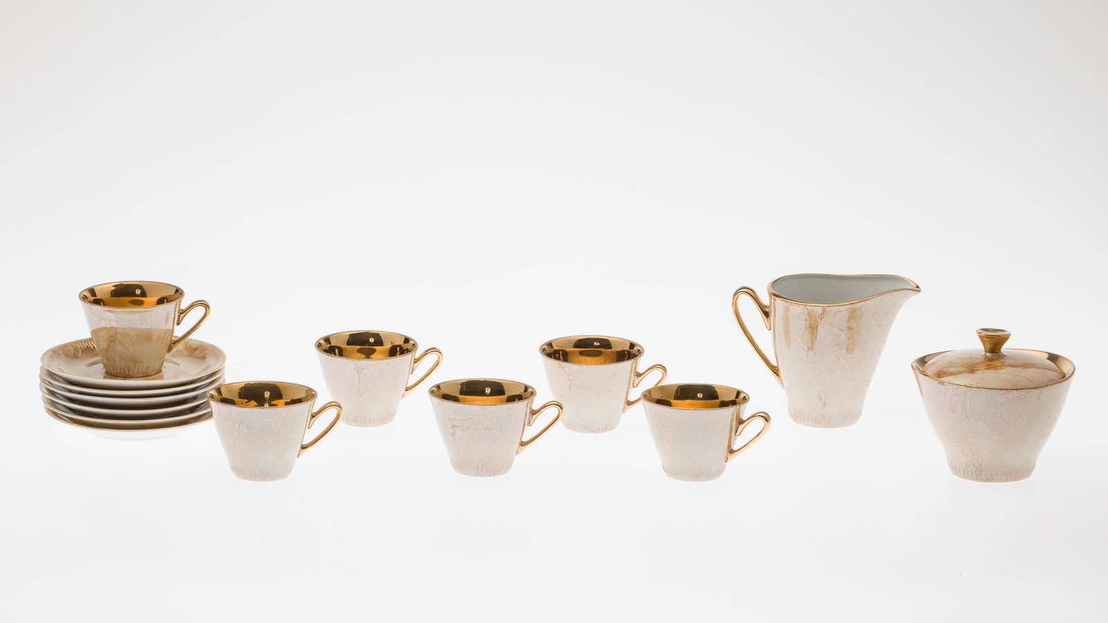 Bronze Lusterware Demitasse Set for 6: Property from a Private Collection, New York City Description: Bronze Lusterware Demitasse Set for 6, comprising 6 demitasse cups, 6 saucers, cream and lidded sugar, all with obscured green mark on