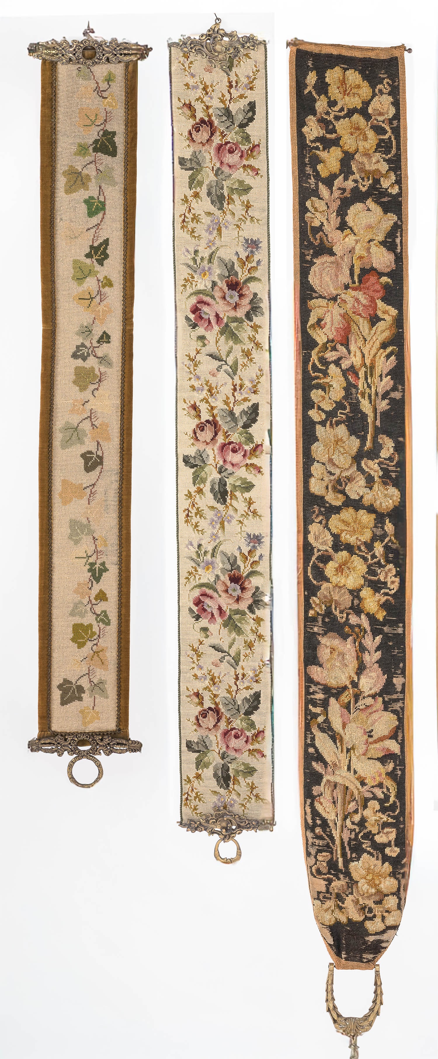 Three Needlework Bell Pulls: Property from a Private Collection, New York City Description: Three Needlework Bell Pulls, one needlework of ivy with velvet backing and metal mounts stamped W.T. Stef, Kobenhavn (bottom mount