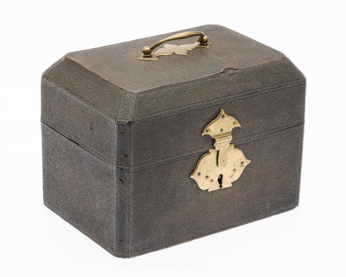 Small Shagreen Box: Property from the Estate of Arthur B. Kouwenhoven Jr., Savannah, GA Description: Small Shagreen Box, metal mounted handle and lock (lacking key), the hinged lid opening to a marbled paper interior.