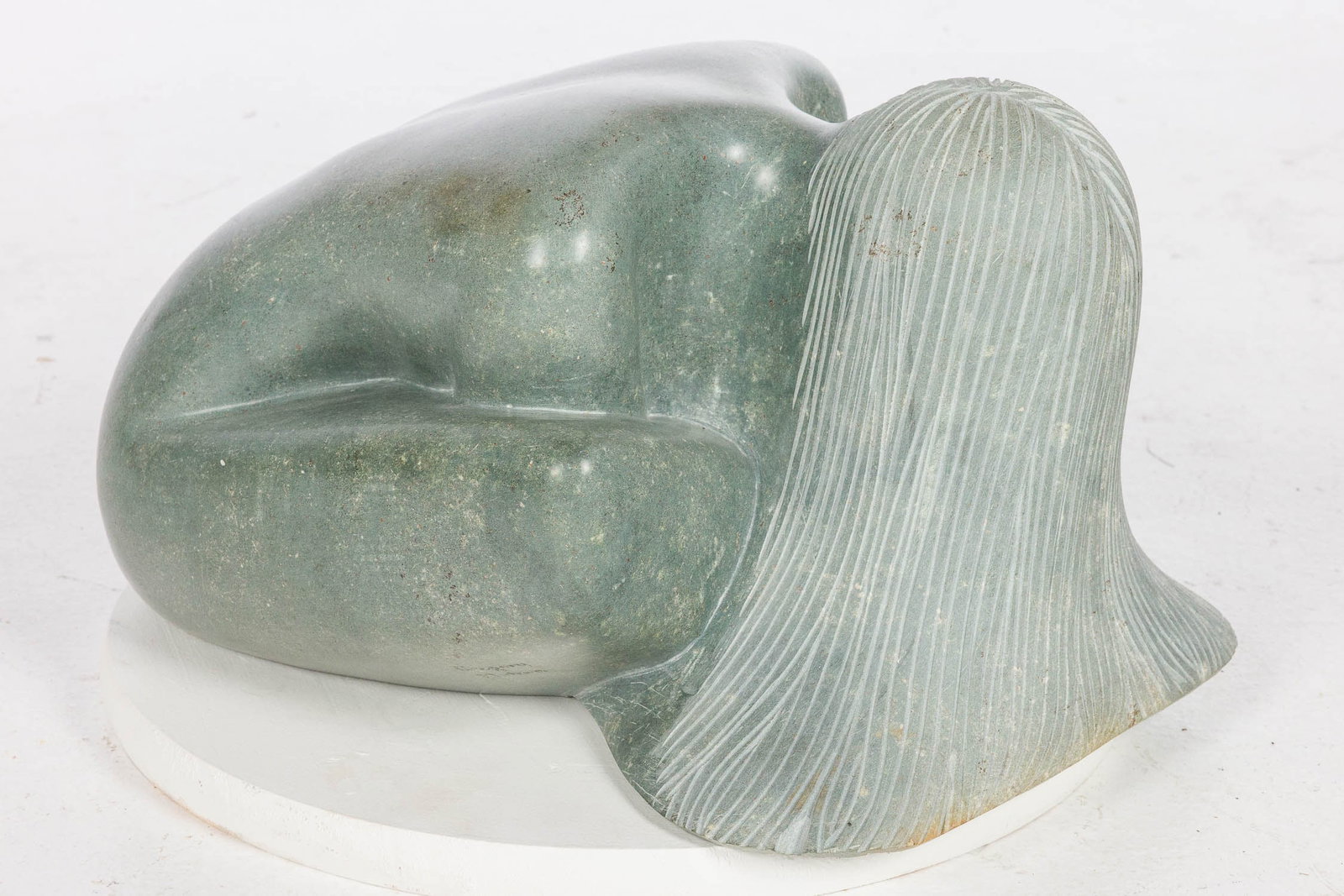 Gregory Mutasa (Zimbabwe), Seated Bather, Stone: Description: Gregory Mutasa (Zimbabwe, b. 1959), Seated Bather, Stone Sculpture, signed on bottom of one leg, a seated figure leaning over with hair covering her face. Measurements: