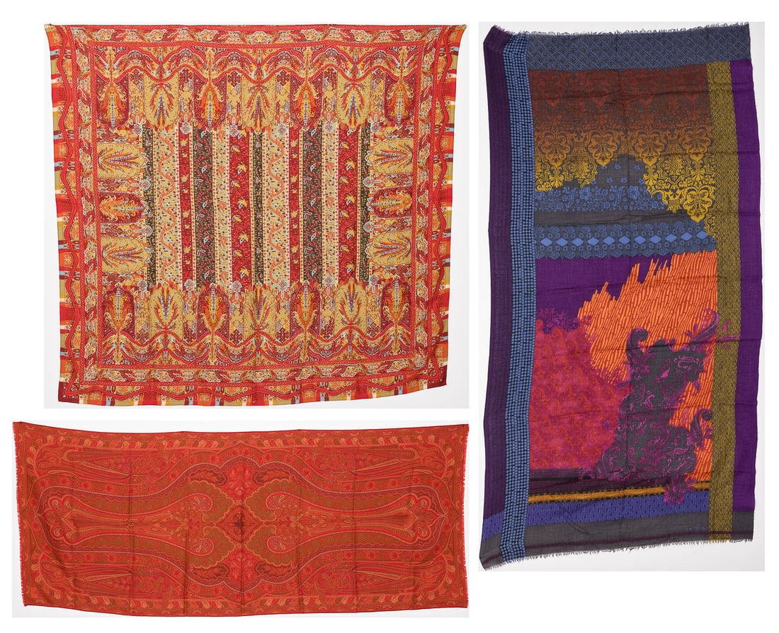 Three Etro Shawls: Description: Three Etro Shawls, comprising a paisley-patterned scarf in tones of orange and red, with brand label lower right corner and short fringe (dimensions of the scarf: 64 in. x 25 1/2 in.);