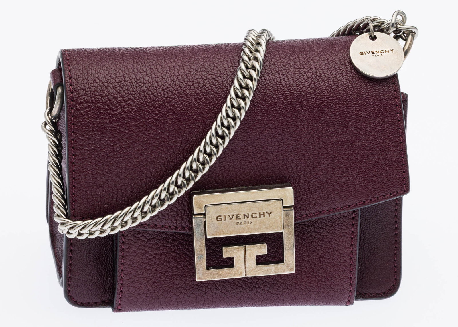 Givenchy GV3 Small Bag: Description: Givenchy GV3 Small Bag, in a deep burgundy goatskin leather with a double G push-lock closure and silver-tone chain-link handle, together with detachable flat leather strap and multiple