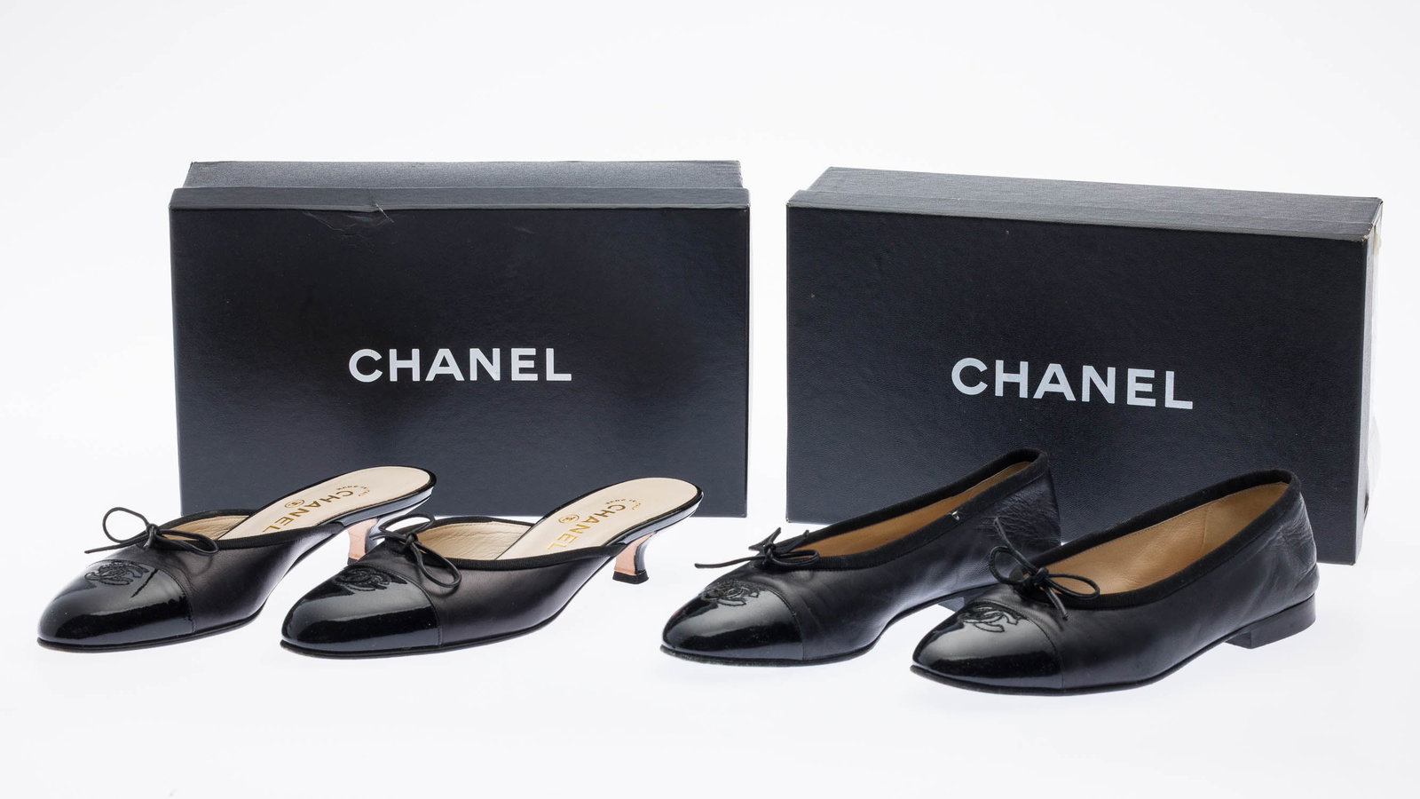 2 Prs Chanel Ballerina Two Tone Flats & Mules: Description: 2 Pairs of Chanel Ballerina Two Tone Flats and Mules Sz 36.5/37, comprising Chanel black patent cap toe leather ballet flats with stitched CC logo and bow detail (size 36 1/2); and