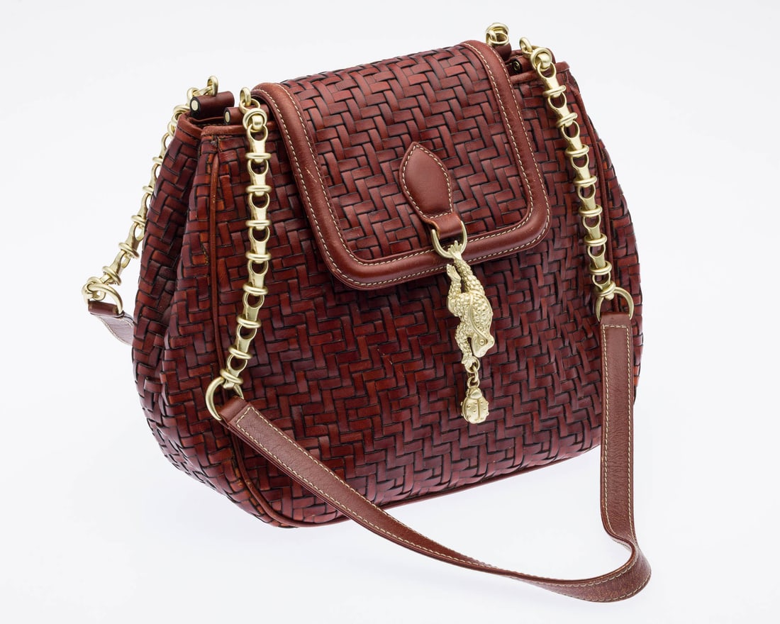 Barry Kieselstein-Cord Woven Leather Shoulder Bag: Description: Barry Kieselstein-Cord Woven Leather Shoulder Bag, with designer's signature gold-tone sculptural hardware, depicting a frog and ladybug detail; double chain-link, leather shoulder strap