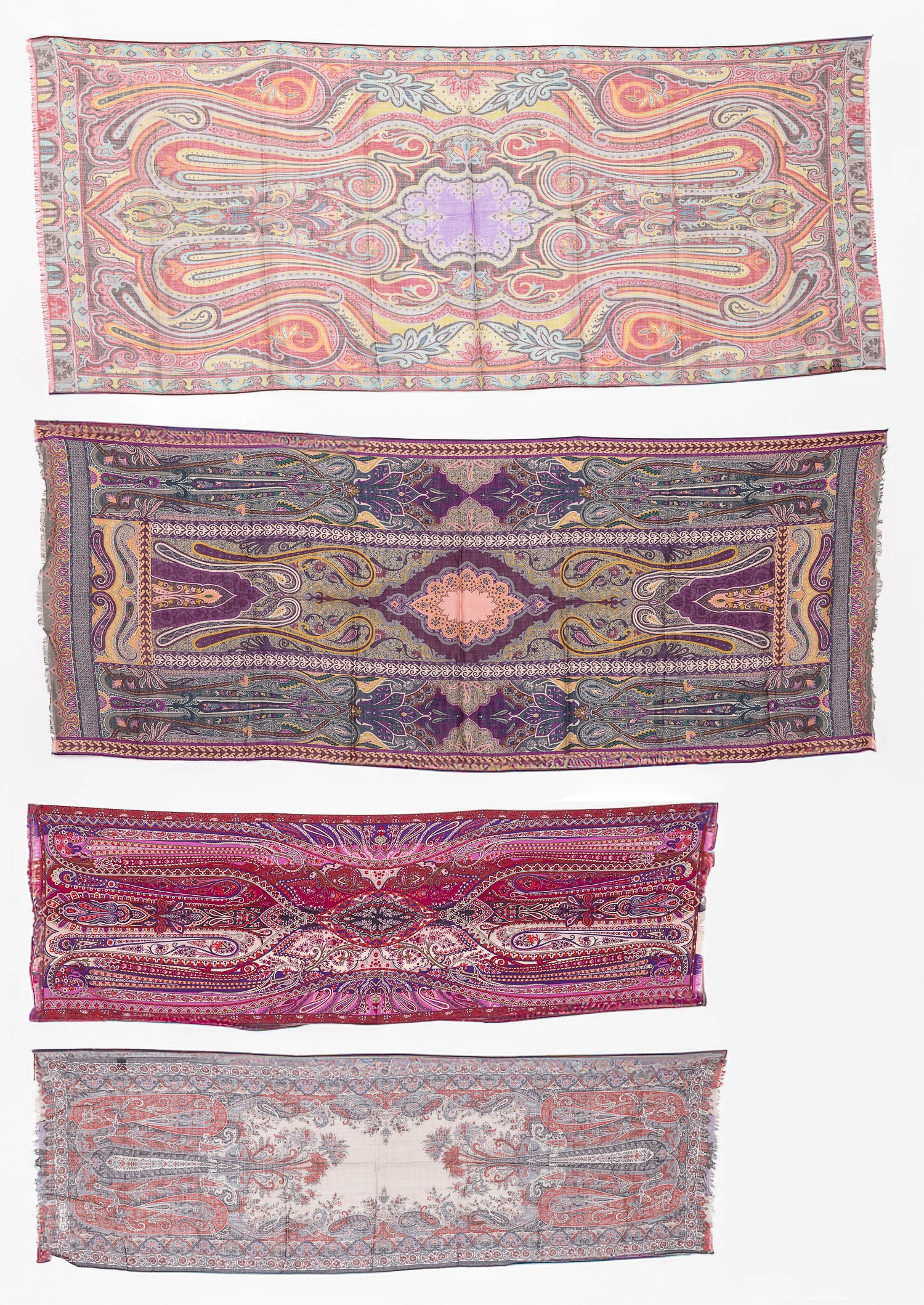 Four Etro Scarfs: Description: Four Etro Scarfs, comprising a paisley-patterned scarf in tones of purple, grey, mustard yellow, and peach, with tag and brand label lower right corner (dimensions of the scarf: 62 i