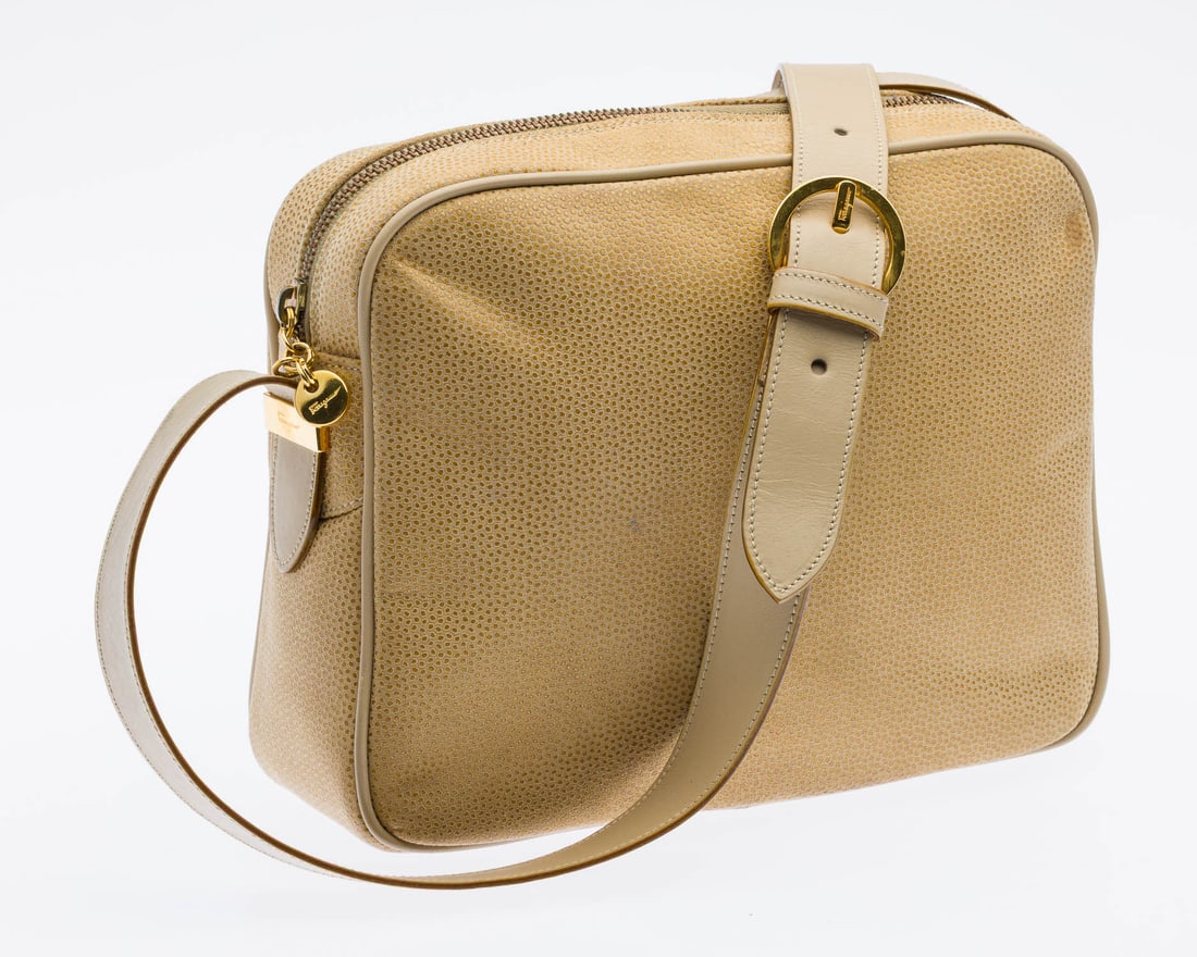 Ferragamo Tan Purse: Description: Ferragamo Tan Purse, compact rectangular leather bag with soft round edges and top-zip closure, adjustable leather shoulder strap, brand leather tab (inscribed D214641) and zipped
