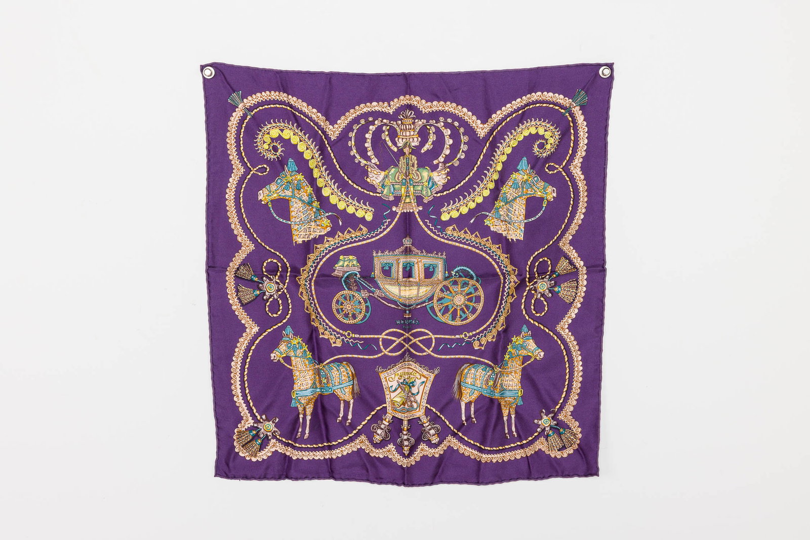 Hermes Paperoles Silk Scarf: Description: Hermes Paperoles Silk Scarf, designed by Claudia Stuhlhofer-Mayr, depicting ceremonial carriage and horses, in tones of rich purple. Measurements: Height: 16 1/2 i
