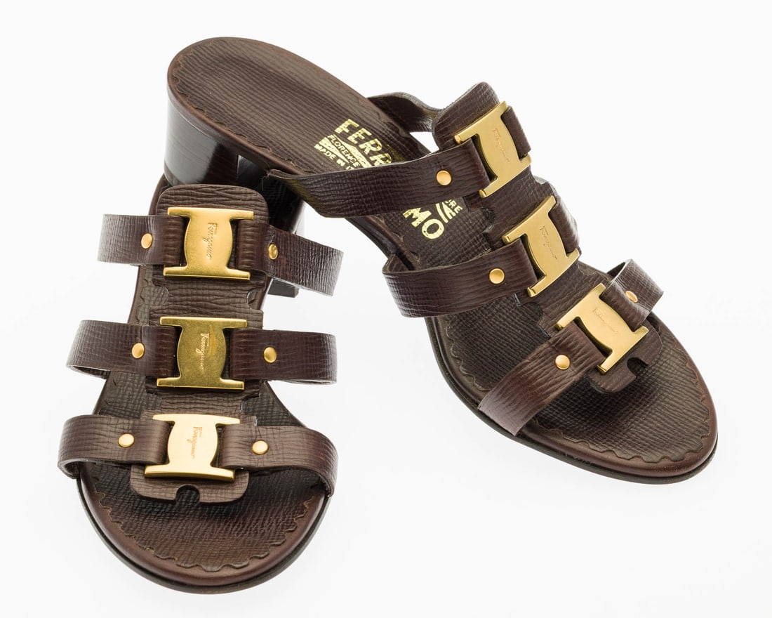 Pair of Ferragamo Amatrice Sandals, Size 6 1/2: Description: Pair of Ferragamo Amatrice Sandals, Size 6 1/2, vintage-style strappy sandals in brown textured leather with gold-tone Gancini logo buckle across the straps, 1 1/2 in. heel.