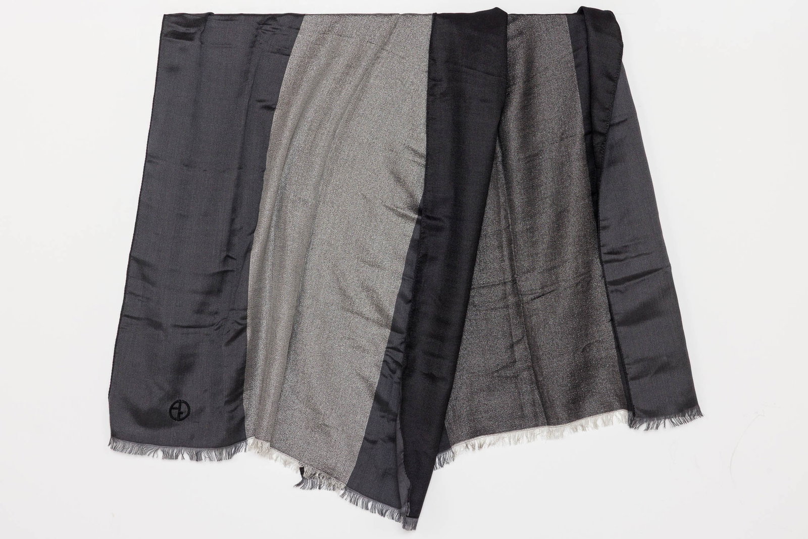 Giorgio Armani Scarf: Description: Giorgio Armani Scarf, with a sewn mark lower right, in tones of grey, silk and black; with short fringe. Measurements: Height: 72 in. x Width: 31 1/2 in.