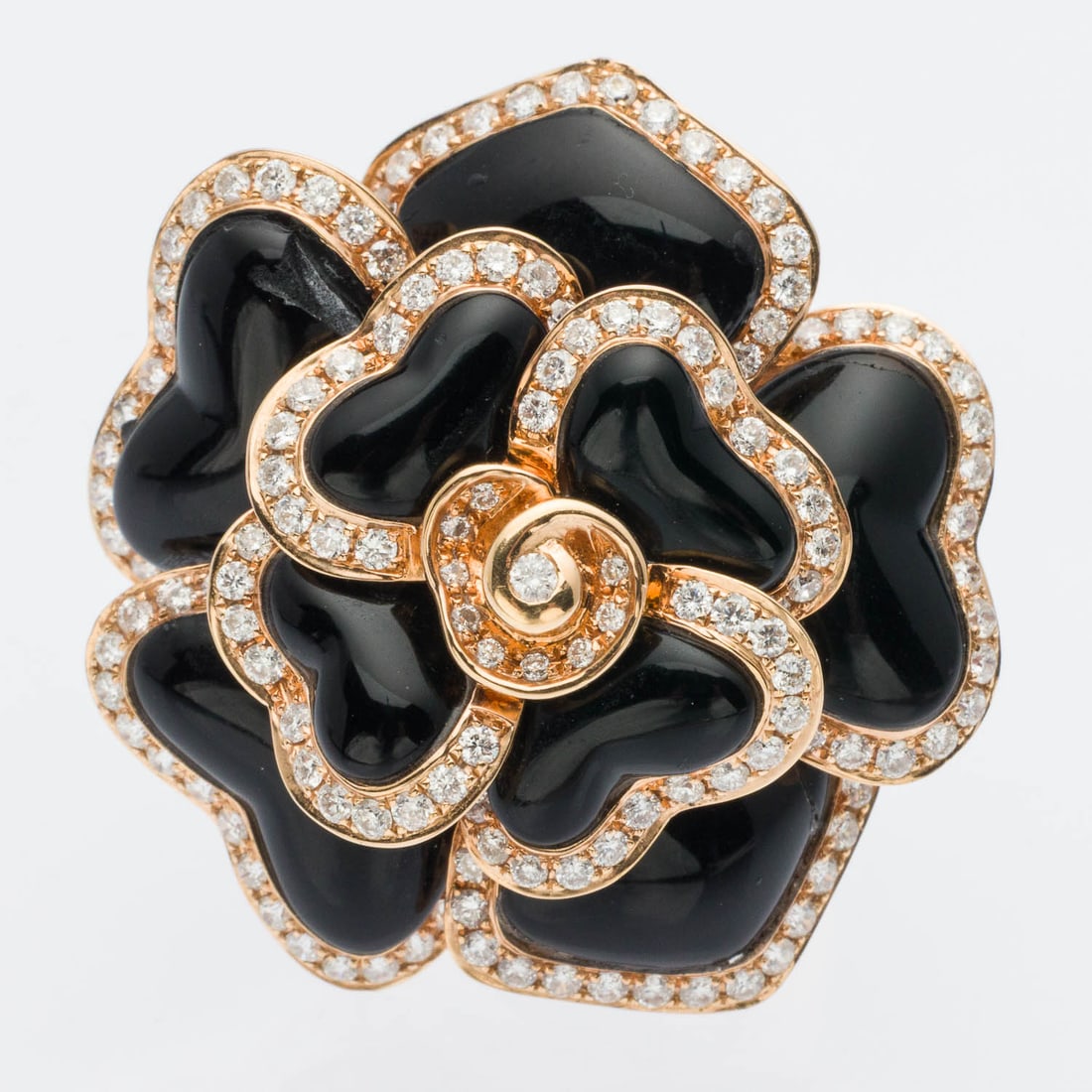 18K Rose Gold and Onyx Floral Ring, Size 6.75: Description: 18K Rose Gold and Onyx Floral Ring, Size 6.75, with three-dimensional flower featuring black onyx petals outlined with near colorless round diamonds (approx. 1.60 cts), mounted in rose