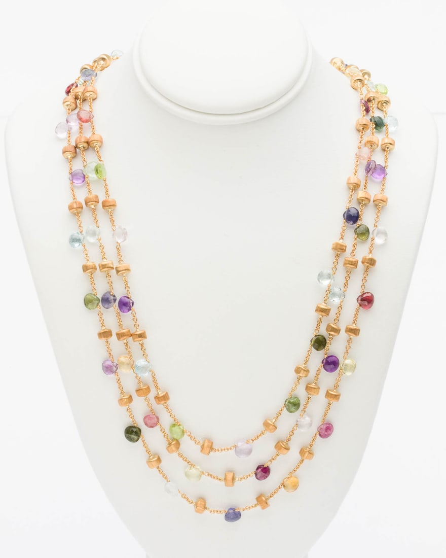 Marco Bicego 18K and Multigem Briolette Necklace: Property from a Private Collection, Savannah, GA Description: Marco Bicego 18K and Multigem Briolette Necklace, three strand yellow gold link necklace featuring various colored gemstone broilettes