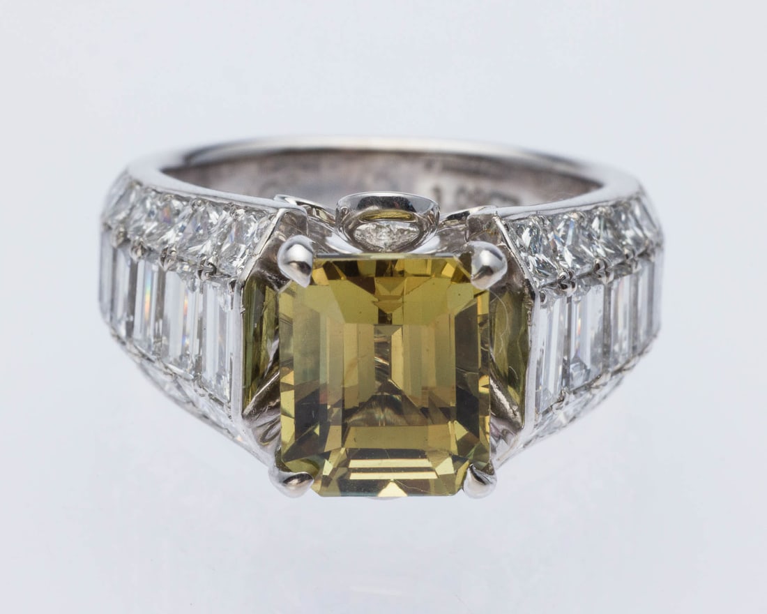 Alexandrite (3.09 cts) & Diamond 18K Ring, GIA Cert: Description: Alexandrite (3.09 cts) and Diamond 18K Gold Ring, Size 5.25, GIA Cert, featuring prong set octagonal step cut Alexandrite (8.44 x 7.01 x 5.55 mm, 3.09 cts, color yellow-green changin