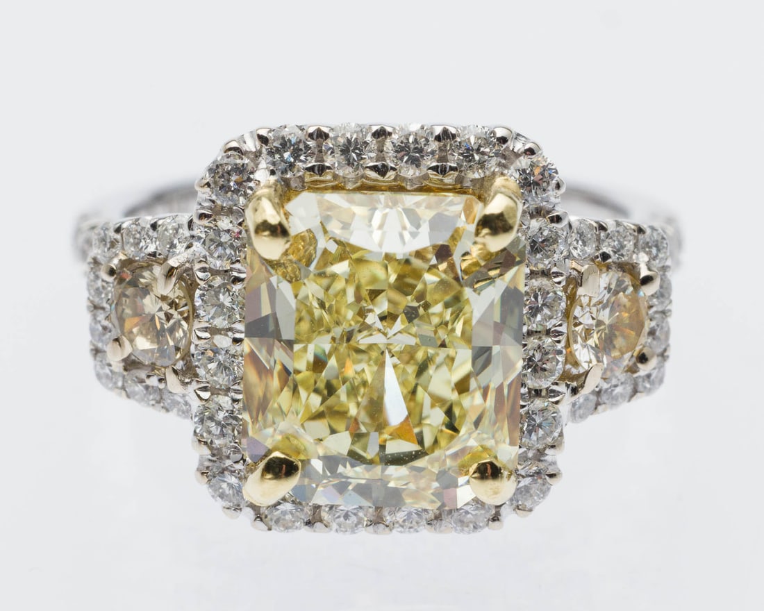 4 ct Fancy Yellow Diamond 18K Ring, GIA Certificate: Description: 18K Gold and 4 cts Fancy Yellow Diamond Ring, Size 6.75, with GIA Certificate, featuring a prong set cut-cornered rectangular modified brilliant fancy yellow diamond (9.76 x 8.45 x 5