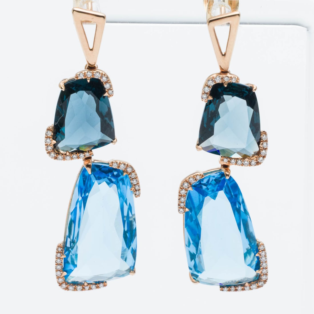 18K Gold, Blue Topaz and Diamond Earrings: Description: 18K Gold, Blue Topaz and Diamond Earrings, each featuring two organic form flat faceted topaz accented with diamonds and mounted in yellow gold with post backs, marked '14K' on backs.