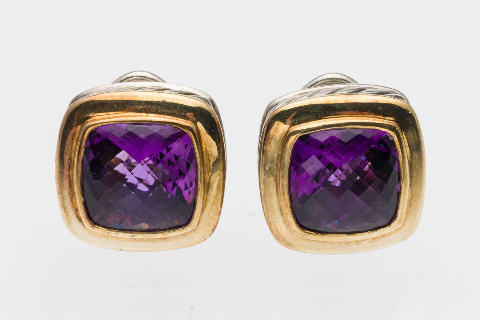 David Yurman Sterling, 18K Gold & Amethyst Earrings: Property from a Private Collection, Savannah, GA Description: David Yurman Sterling Silver, 18K Gold and Amethyst Earrings, each featuring a square cross cut amethyst bezel set in yellow gold and