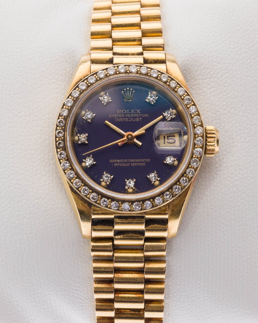 Rolex 18K Diamond Presidential Ladies Watch, 1984: Property of a Private Collector, Hilton Head, SC. Description: Rolex 18K Gold and Diamond Presidential Ladies Watch, 1984, with Rolex Jewelry Box, the blue dial with diamond indicators, marked 'Ro