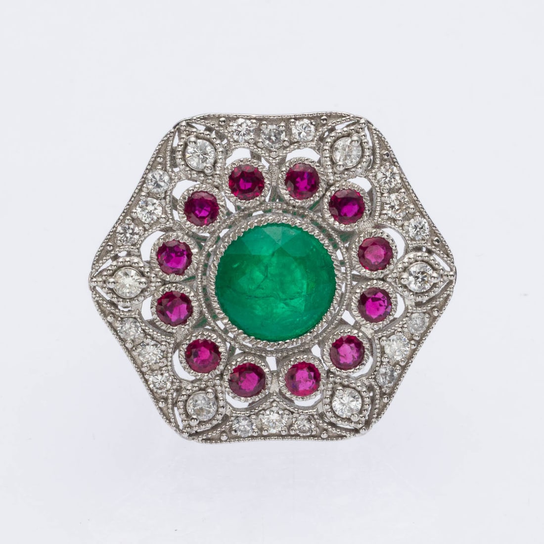 Emerald, Ruby and Diamond Platinum Ring, Size 7: Description: Emerald, Ruby and Diamond Platinum Ring, Size 7, featuring central round emerald (approx. 3.94 cts) surrounded by 12 round rubies (approx. 1.33 cts) and various round diamonds (appro