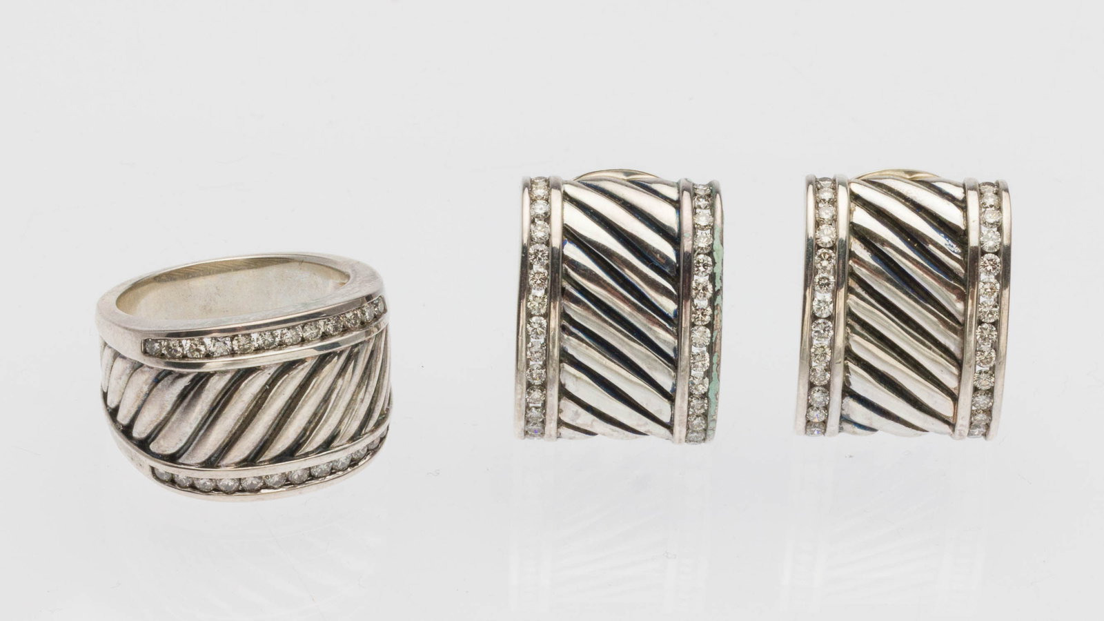 David Yurman Sterling and Diamond Earrings & Ring: Property from a Private Collection, Savannah, GA Description: David Yurman Sterling Silver and Diamond Cable Earrings and Ring, sterling silver cable cuff earrings featuring two rows of channel se