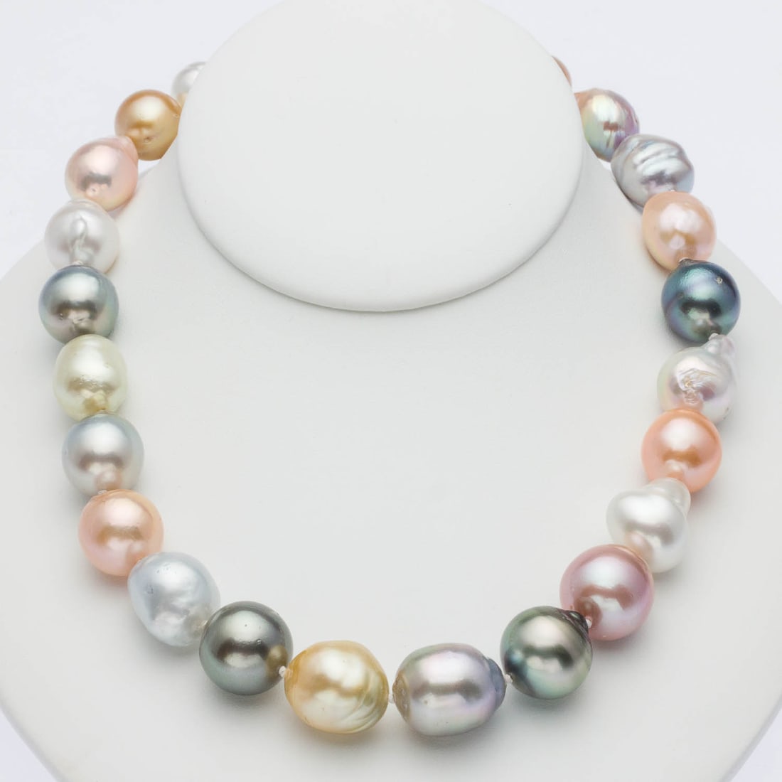 Multicolored South Sea Baroque Pearl Necklace: Description: Multicolored South Sea Baroque Pearl Necklace, pearls approx. 15mm-18mm strung with a 14K yellow gold ball-form clasp, marked '14K, 585' on one side. Measurements: