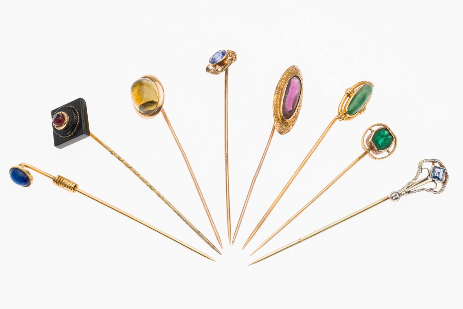 8 Gold and Stone Stick Pins: Property from a Private Collection, Jacksonville, FL Description: 8 Gold and Stone Stick Pins, comprising an amethyst pin (marked '10K', 1.41 grams); a citrine pin (unmarked); a lapis pin (unmarke