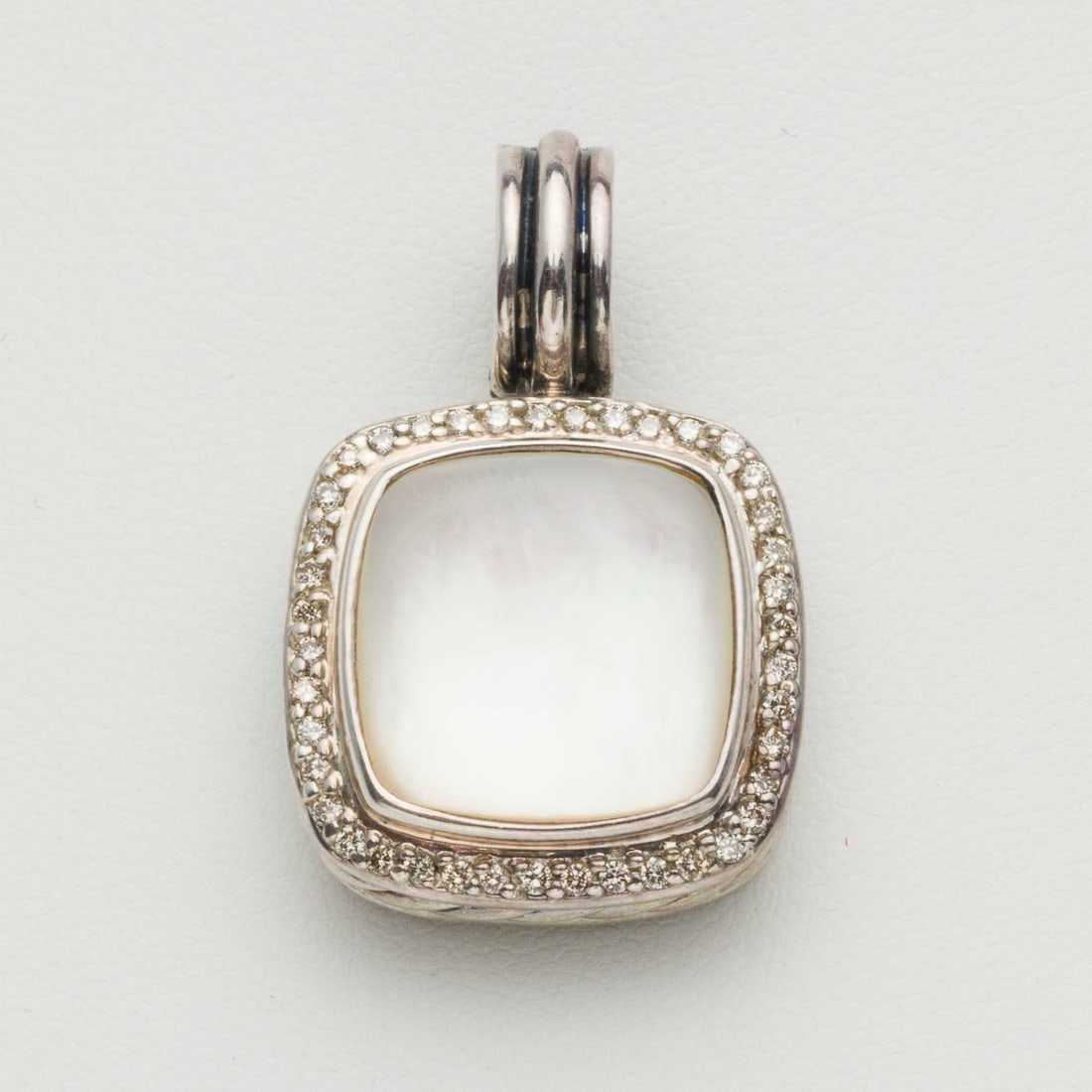 David Yurman Sterling, Diamond and MOP Pendant: Property from a Private Collection, Savannah, GA Description: David Yurman Sterling Silver, Diamond and Mother-of-Pearl Pendant, rounded square pendant featuring mother of pearl bezel set in sterl