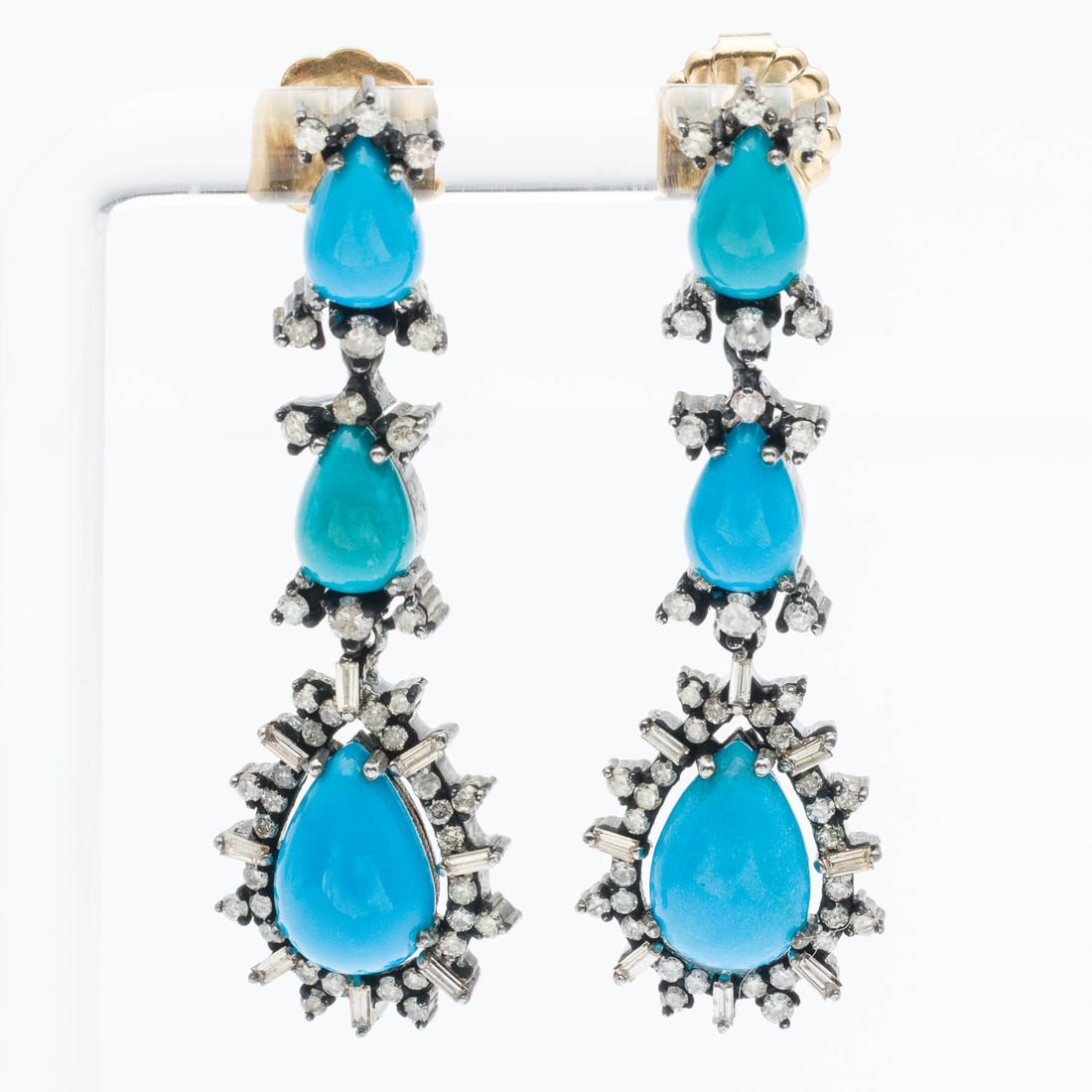 Pair Sterling Silver, Diamond & Turquoise Earrings: Description: Pair of Sterling Silver, Diamond and Turquoise Earrings, each featuring three pear shaped turquoise cabochons framed by round and baguette near colorless diamonds mounted in sterling