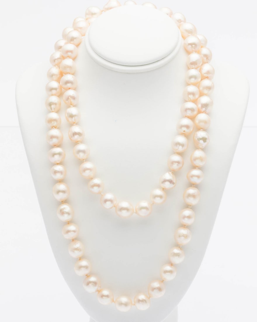 30 in. Pearl Necklace: Description: 30 in. Pearl Necklace, a continuous strand of pearls ranging from 8.8 mm - 9.5 mm. Measurements: Length: 30 in.