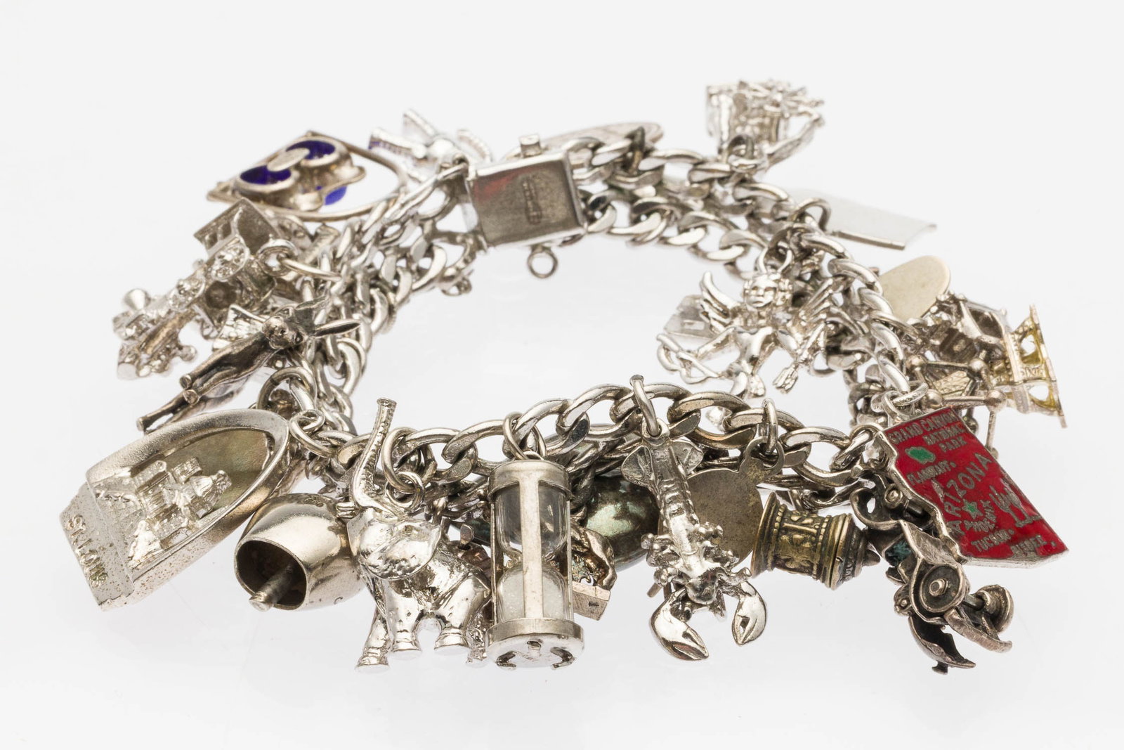 Sterling Silver Charm Bracelet: Property of a Private Collector, Savannah, GA Description: Sterling Silver Charm Bracelet, double-link sterling silver chain with box clasp, marked 'American Sterling' on clasp, with approximately 31