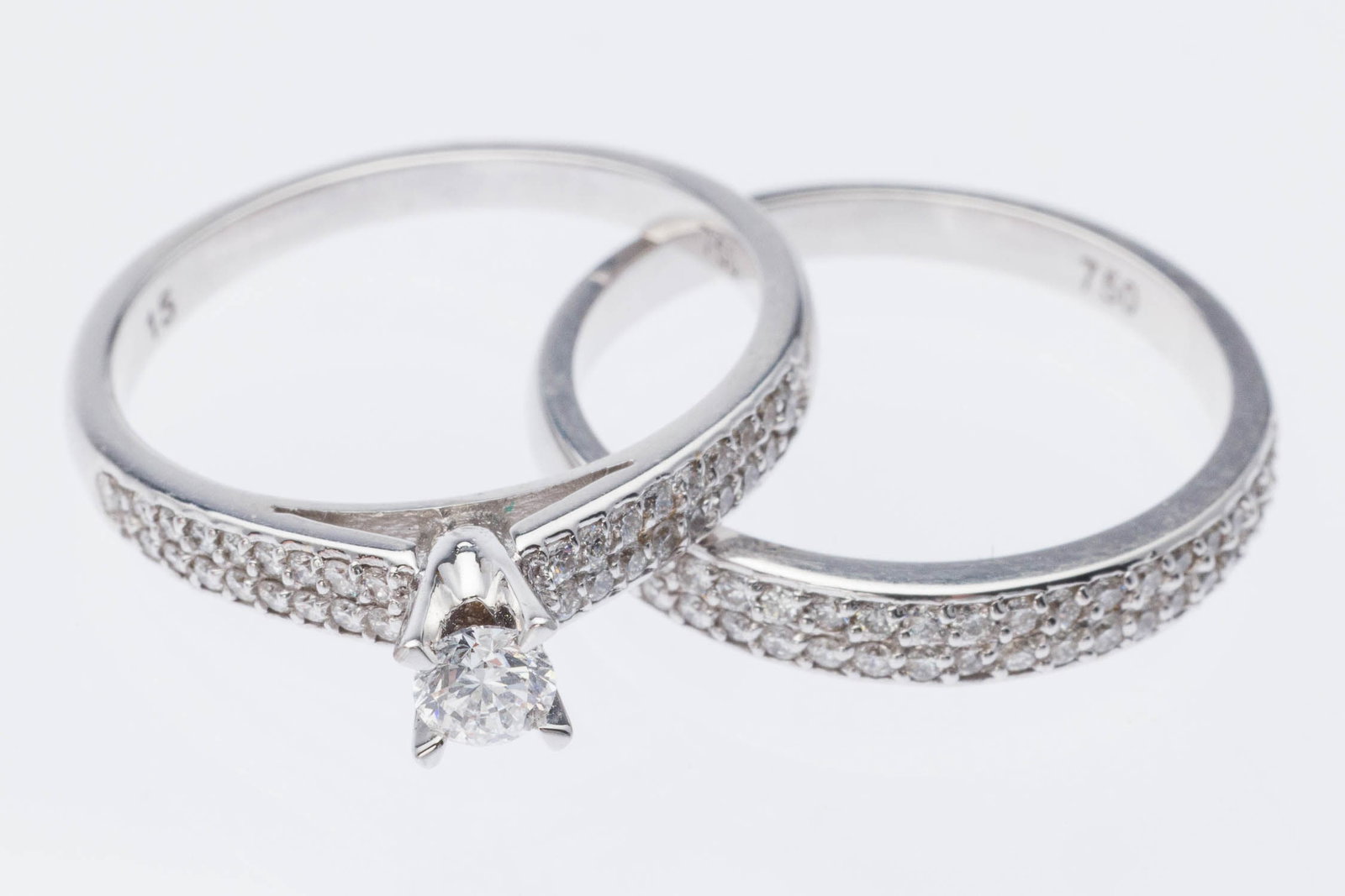 18K Gold and Diamond Engagement Set, Size 6.5: Description: 18K Gold and Diamond Engagement Set, Size 6.5, 18K white gold engagement ring featuring a prong set round brilliant diamond (approx. 3.4 mm, 0.34 cts) the shoulders of the band with two