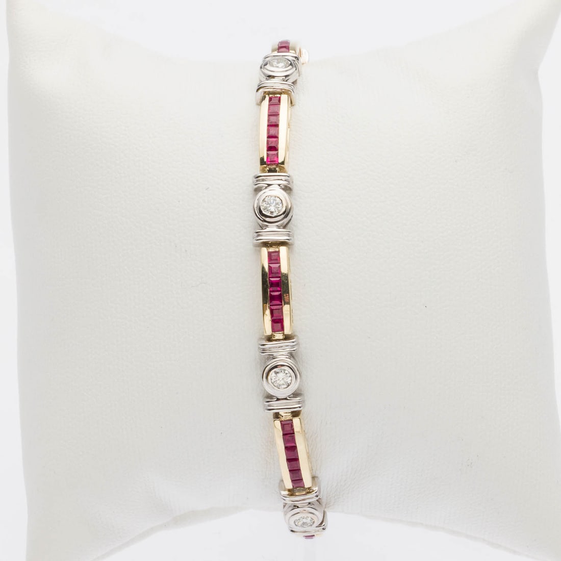 Ruby and Diamond 14K Gold Tennis Bracelet: Description: Ruby and Diamond 14K Gold Tennis Bracelet, featuring square cut rubies (approx. 2 cts) set in yellow gold links alternating with round diamonds (approx. 1 ct, G-H, VS-SI) set in whit