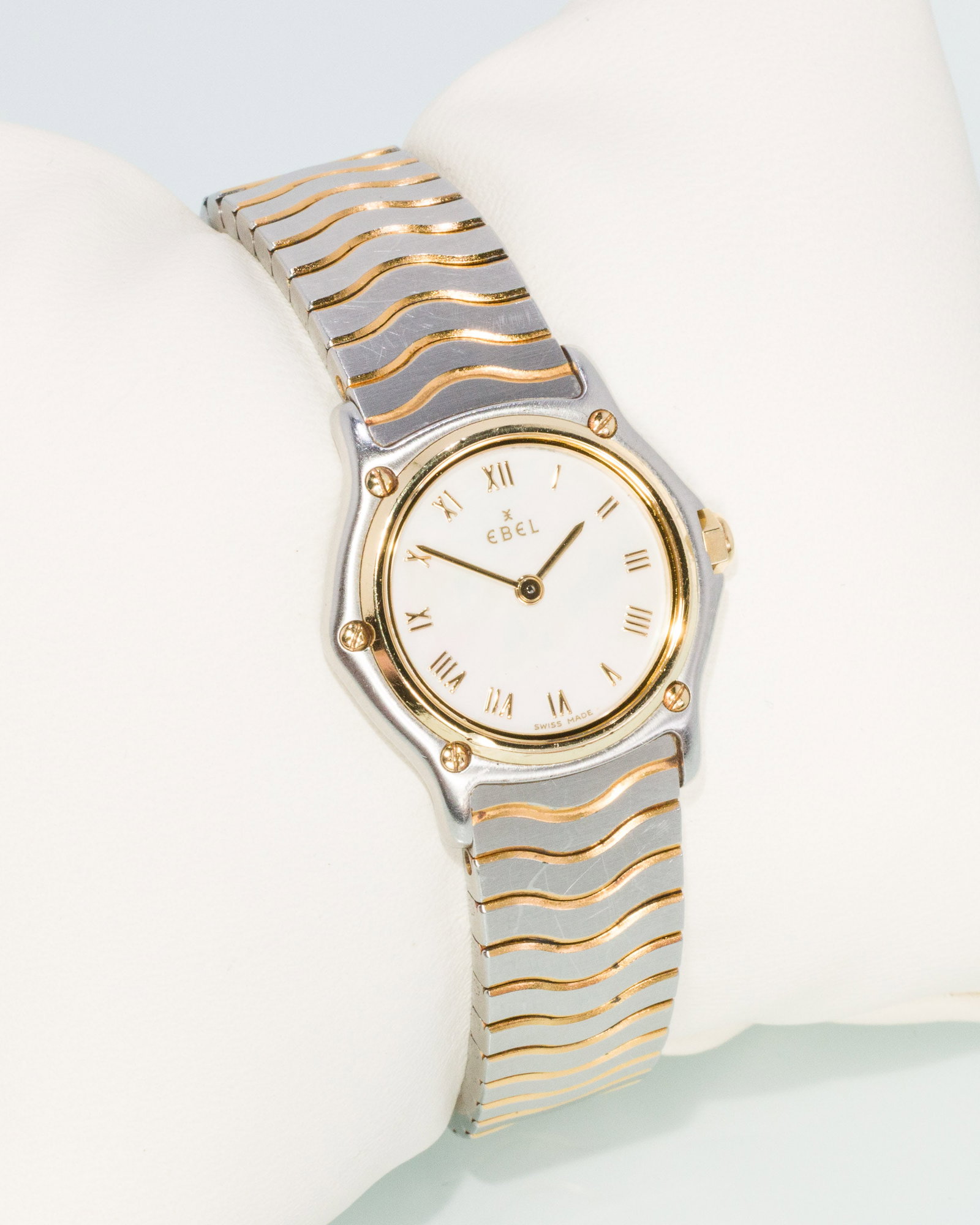 Ebel Stainless & Gold Sport Classique Lady's Watch: Description: Ebel Stainless Steel and Gold Sport Classique Lady's Watch, stainless steel and yellow gold with mother-of-pearl dial and gold Roman numerals, marked on back of case 'stainless steel
