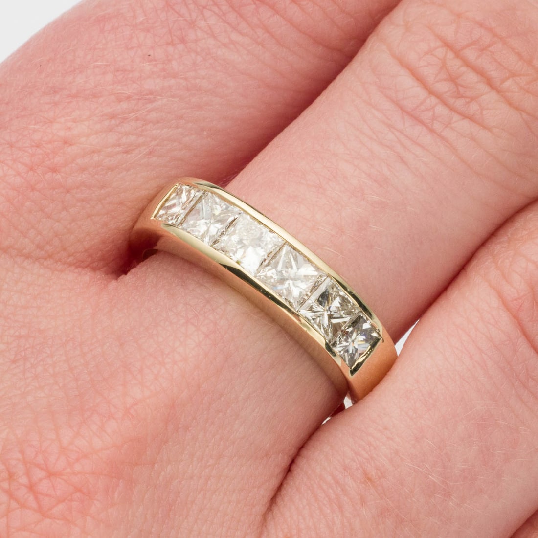 Men's Diamond and 14K Ring, Size 8.75: Description: Men's Diamond and 14K Ring, Size 8.75, featuring 6 princess cut diamonds (approx. 1.75 cts, G-H, VS1-VS2) channel set in a yellow gold band, marked '14K' on inside of band. 6.09 gram
