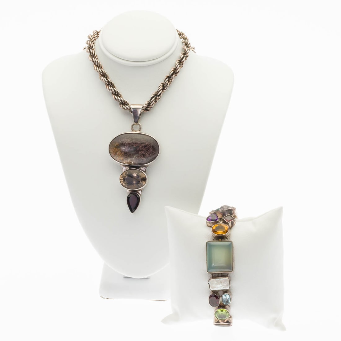 Sterling & Multigem Bracelet & Pendant on Chain: Property from a Private Collection, Jacksonville, FL Description: Sterling Silver and Multigem Bracelet and a Pendant on Chain, a sterling silver bracelet featuring various faceted gem stones,