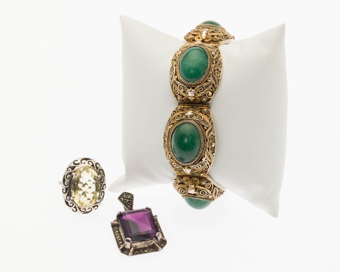 Filigree and Jade Bracelet, Ring and Pendant: Property from a Private Collection, Jacksonville, FL Description: Filigree and Jade Bracelet, Ring and Pendant, comprising a filigree bracelet featuring four oval jade cabochons, with box clasp and