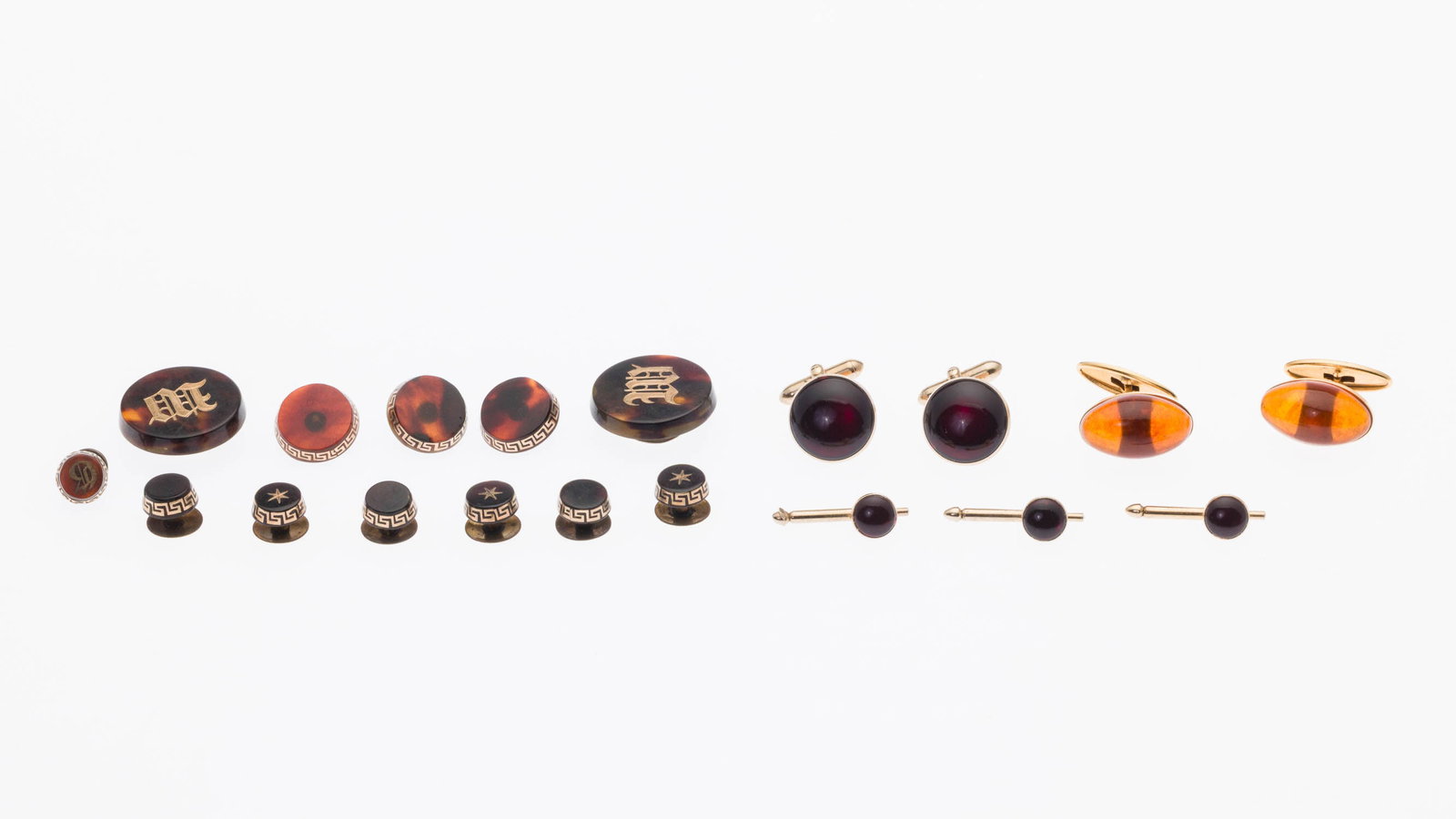 Three Groups of Gold Tone Cuff Links: Property from a Private Collection, Jacksonville, FL Description: Three Groups of Gold Tone Cuff Links, comprising a pair of gold-tone and orange glass cabochon cuff links (marked '7R'); a pair of