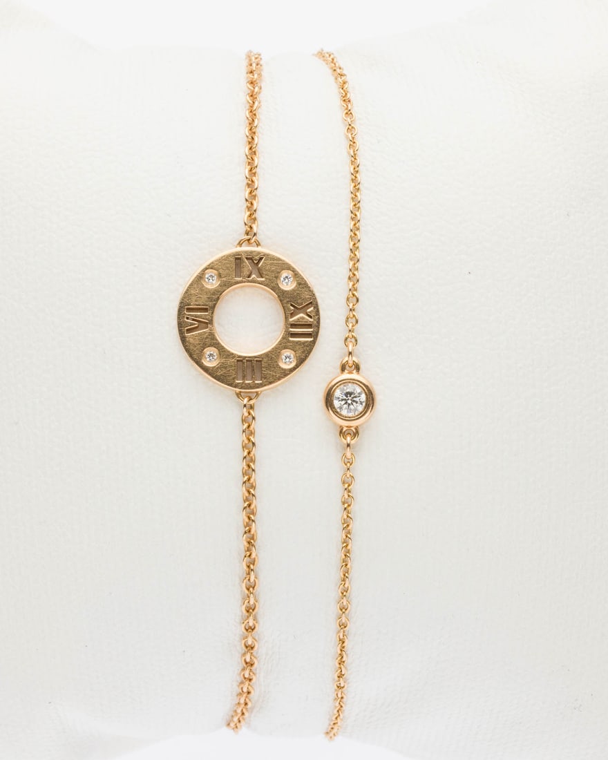 Two Tiffany & Co 18K and Diamond Bracelets: Description: Two Tiffany & Co 18K and Diamond Bracelets, comprising a 18K yellow gold chain bracelet with single bezel set diamond (approx. 3 mm), marked 'Span, Peretti' and Tiffany & Co, AU 750'