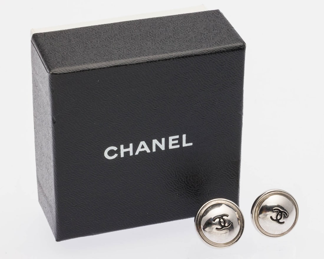 Pair of Chanel Silver-Tone Stud Earrings: Property of a Private Collector, Savannah, GA Description: Pair of Chanel Silver-Tone Stud Earrings, round silver-tone earrings with interlocking black C logo in centers, with post backs marked