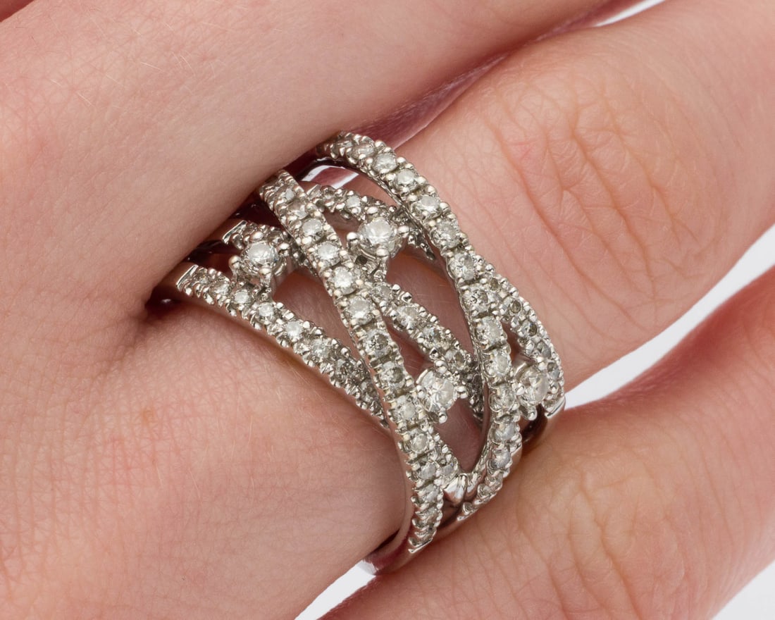Diamond Crossover 14K Gold Ring, Size 6.75: Description: Diamond Crossover 14K Gold Ring, Size 6.75, featuring approx. 1 cts of round cut diamonds bead set in 14K white gold band with pierced crossover design, marked '14K' on inside of band.