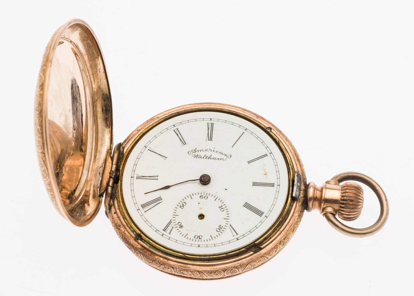 American Waltham Gold Filled Pocket Watch: Property from a Private Collection, Jacksonville, FL Description: American Waltham Gold Filled Pocket Watch, the white face with Roman numerals, marked 'American Waltham', with secondary seconds d
