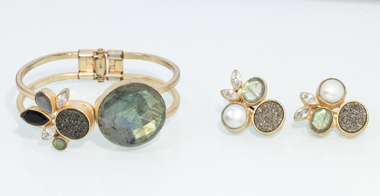 Zia Sachedina (Savannah, 21st C) Earrings & Bracelet: Property of a Private Collector, Savannah, GA Description: Zia Sachedina (Savannah, 21st C) Earrings and a Bracelet, gold tone cuff bracelet with various bezel set gemstones and rhinestones,