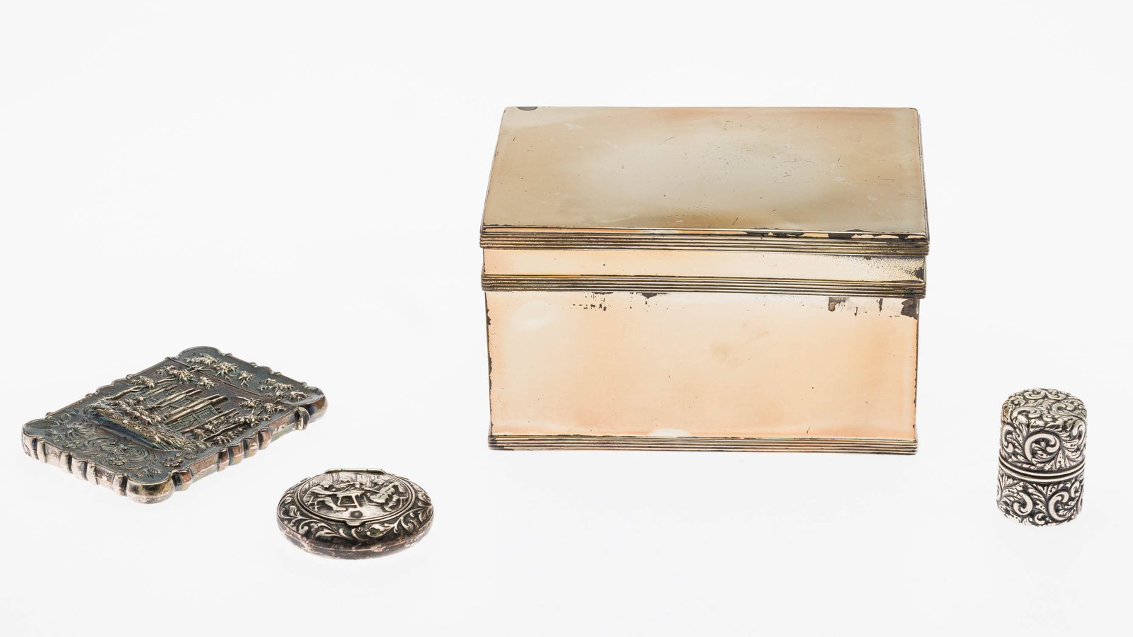 4 Continental Silver Boxes: Property of Bliss Hebert and Allen Charles Klein Description: 4 Continental Silver Boxes, comprising 2 repousse snuff boxes, one Dutch and other with sterling mark, card case and European humidor.