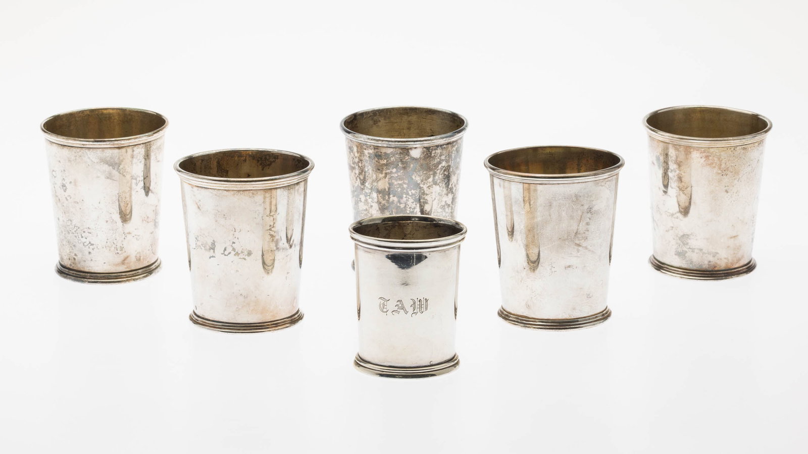 5 S. Kirk & Son Sterling Mint Juleps & a Cup: Property from a Private Collector, Savannah, GA Description: 5 S. Kirk & Son Sterling Mint Juleps & a Cup, comprising 5 mint juleps and a J. E. Caldwell & Co. Washington reproduction cup,