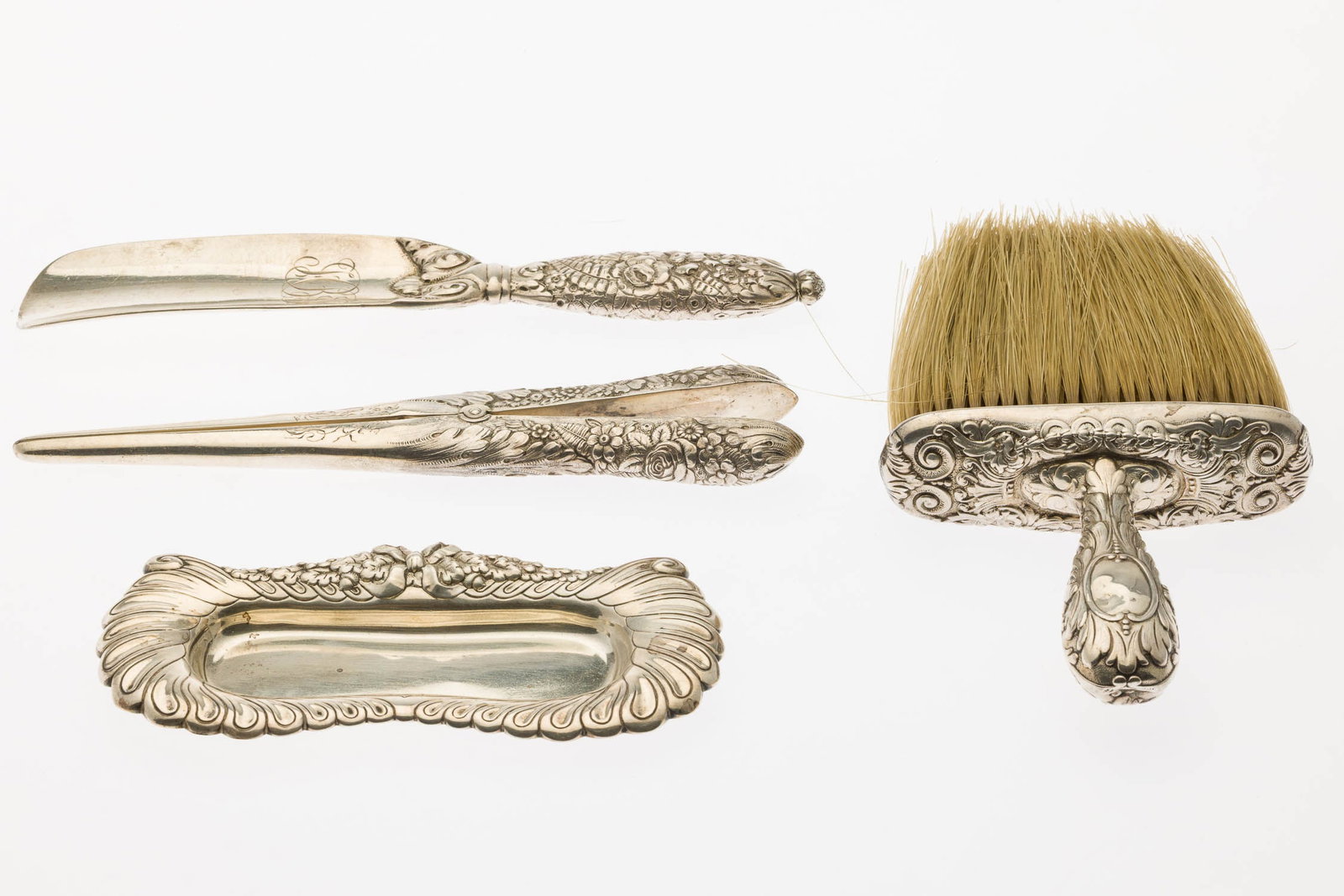 Tiffany 4 Piece Sterling Silver Dressing Set: Property of a Private Collector, St. Simons Island, GA Description: Tiffany 4 Piece Sterling Silver Dressing Set, comprising a brush (monogrammed, with a dent), shoe horn (monogrammed, mark dating it