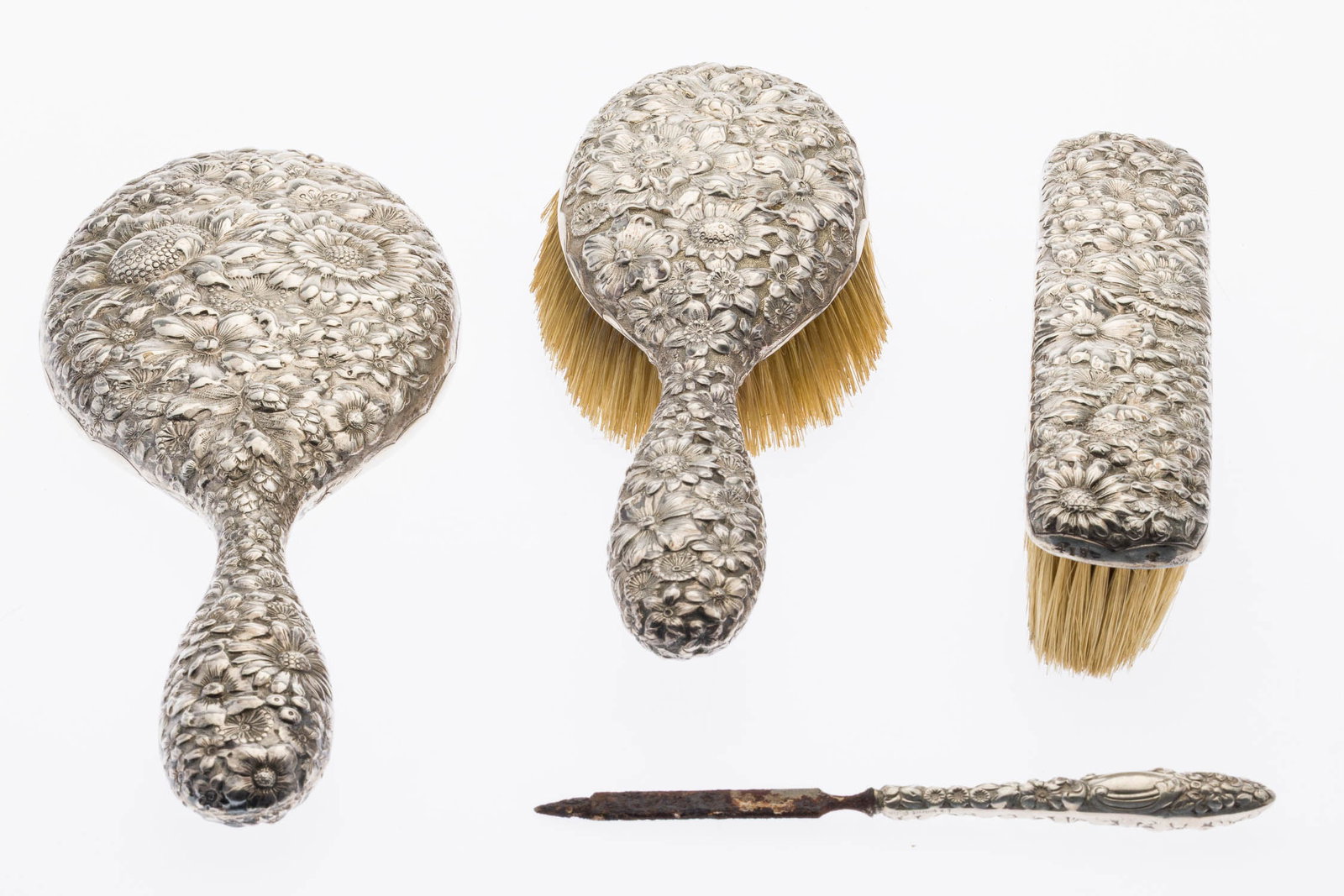 Gorham 4 Piece Sterling Repousse Dressing Set: Property of a Private Collector, St. Simons Island, GA Description: Gorham 4 Piece Sterling Repousse Dressing Set, comprising 2 brushes, a mirror and a nail file. Measurements: Length: of mirror 11