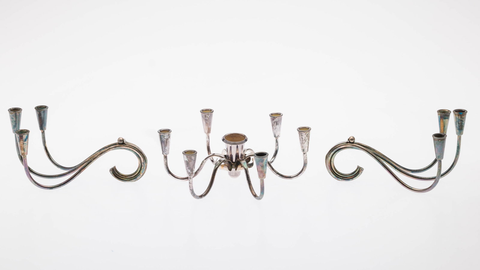 3 Danish Carl Christensen Silverplate Candle Holders: Property from a Private Collection, Savannah, GA Description: 3 Danish Carl Christensen Silverplate Multi-Light Candle Holders, dated between 1943-1963, comprising two three-light candle holders and
