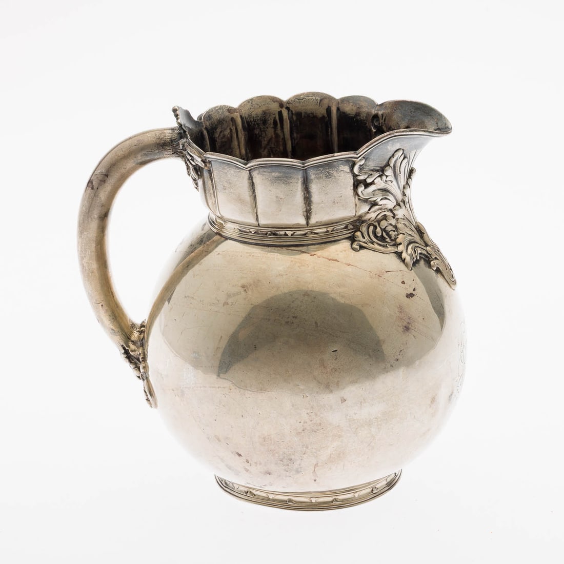 Tiffany Sterling Silver Water Pitcher: Property of a Private Collector, St. Simons Island, GA Description: Tiffany Sterling Silver Water Pitcher, marked Tiffany & Co. on the underside with 'T' date mark, monogrammed. 23.52 troy ounces.