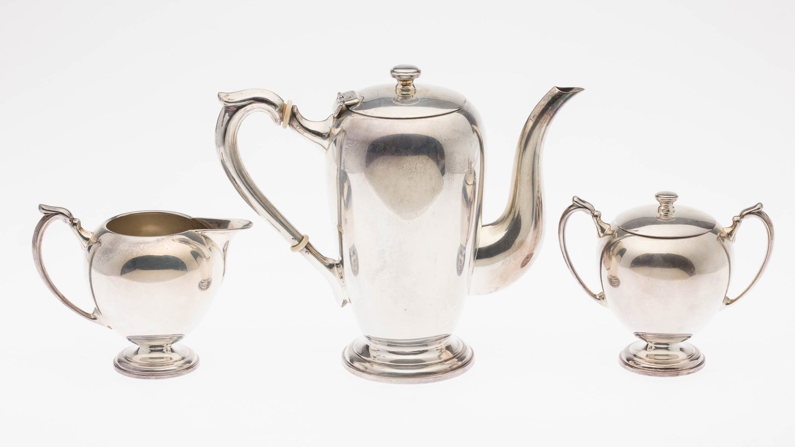 Camusso 3 Piece Sterling Silver Coffee Set: Property of Washington, D.C. Estate Description: Camusso 3 Piece Sterling Silver Coffee Set, comprising a coffee pot, cream and lidded sugar, marked 'Sterling, 925, Camusso, made in Peru'. 32.18 troy