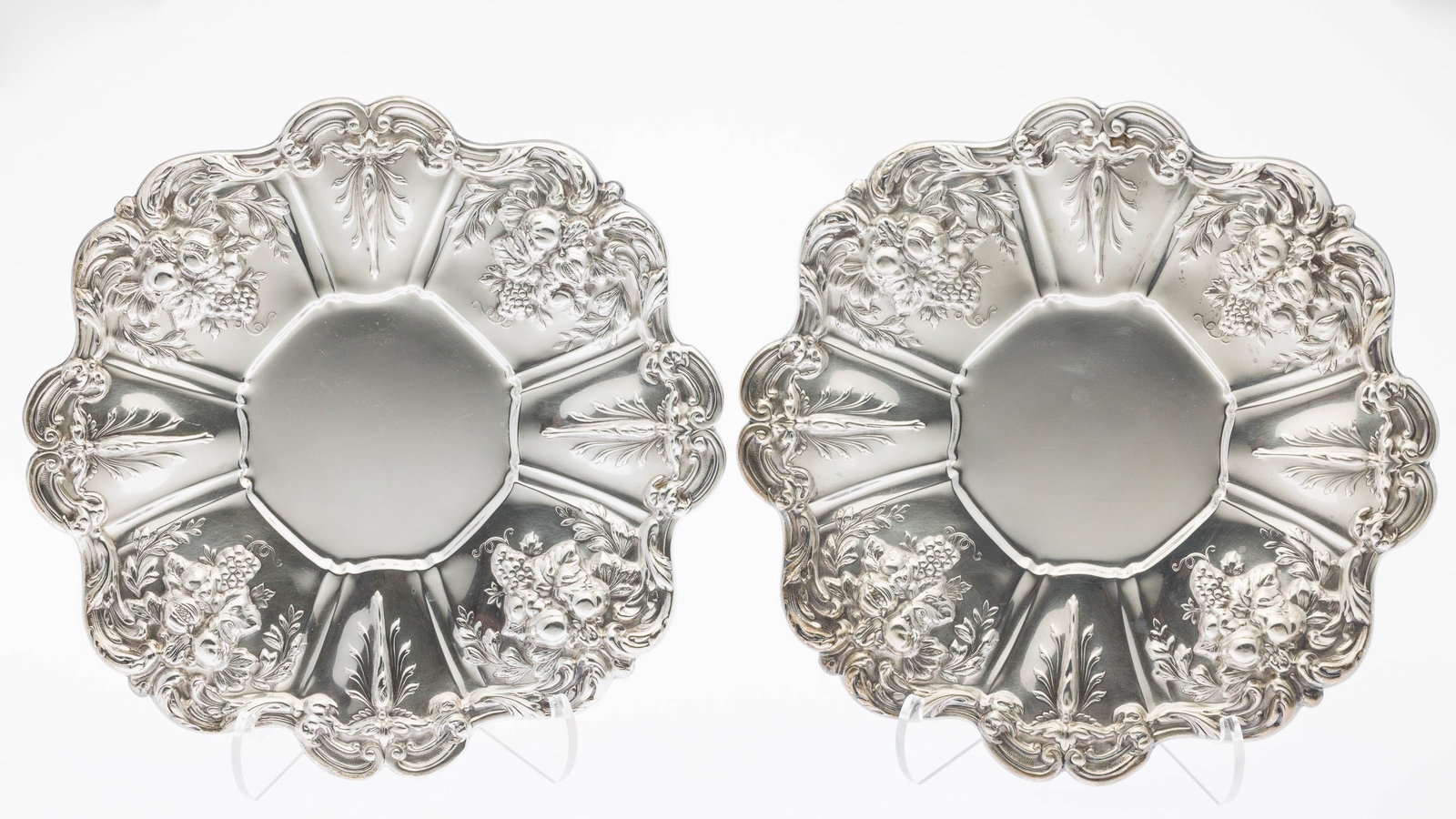 2 Reed & Barton Francis I Sterling Silver Platters: Description: 2 Reed & Barton Francis I Sterling Silver Platters, with floral motifs and scalloped edge. 35.53 troy ounces. Measurements: Height: 1 in. x Width: 11 1/2 in. x Depth: 11 1/2 in.
