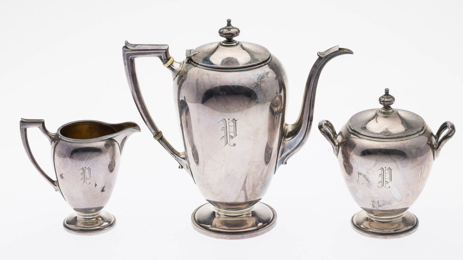 Dominick & Haff Sterling Silver Coffee Service: Property of a Private Collector Hilton Head Island, SC Description: Dominick & Haff Sterling Silver Coffee Service, comprising creamer, sugar bowl, and coffee pot, inscribed 'Presented to Gustav L.